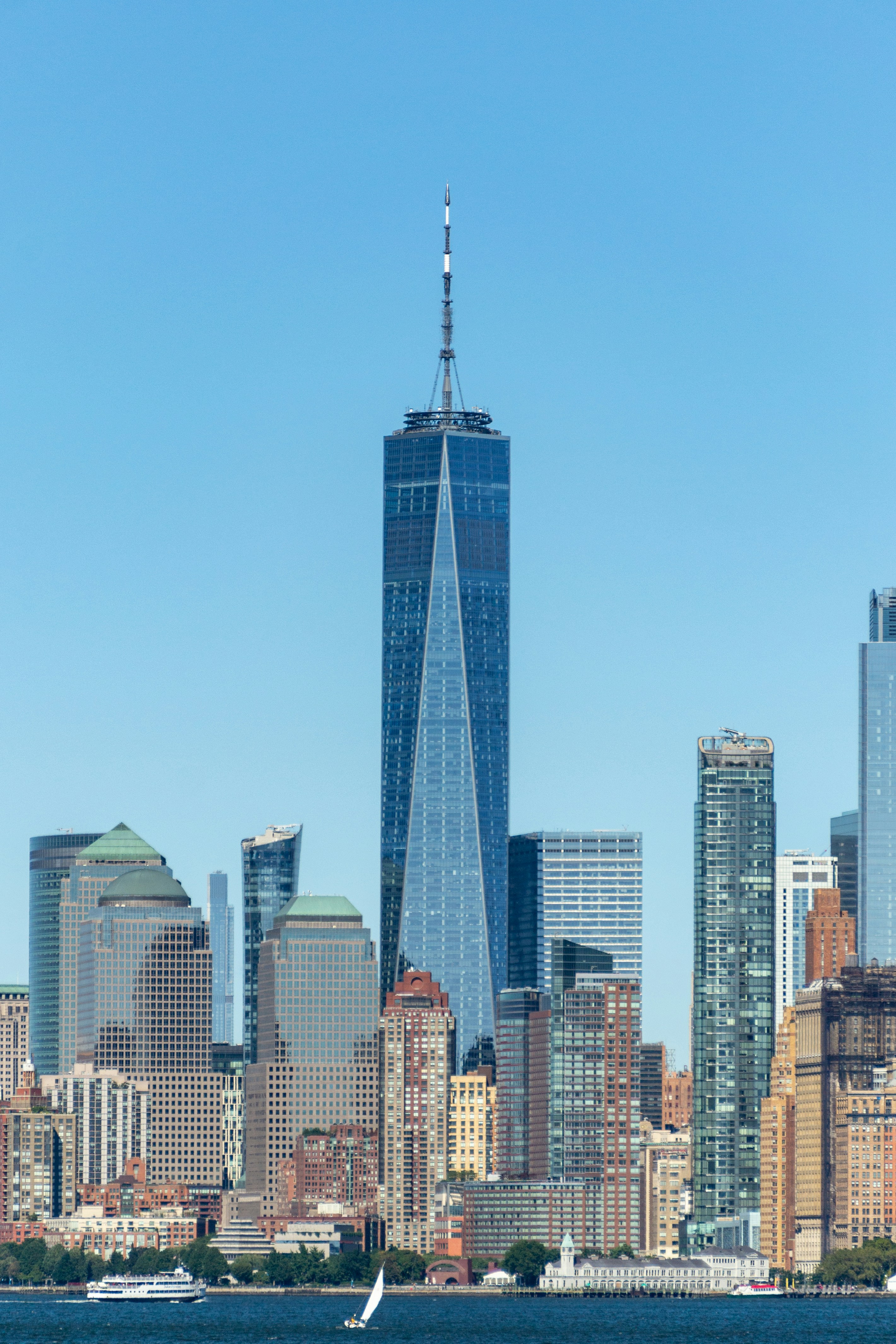 Photograph of the One World Trade Center tower in the Lower Manhattan skyline on a clear day